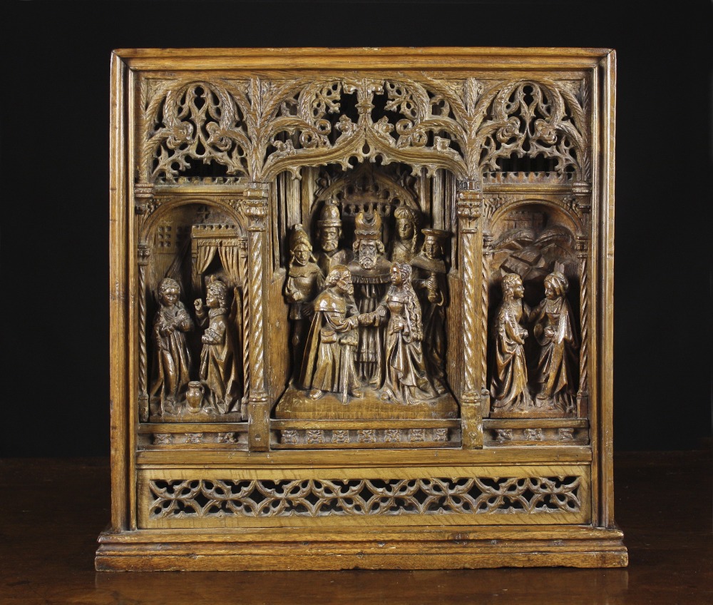 A Fine Gothic Oak Retable Carving, intricately worked in relief with three scenes framed by an