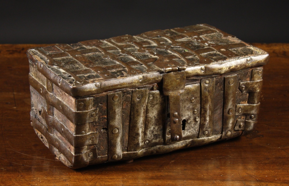 A 15th Century French Leather Clad Casket of rectangular form, bound in iron straps with iron hasp