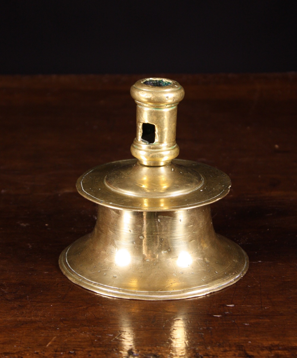A 16th Century Flemish Capstan Candlestick.  The candle nozzle pierced with a lateral ejector hole