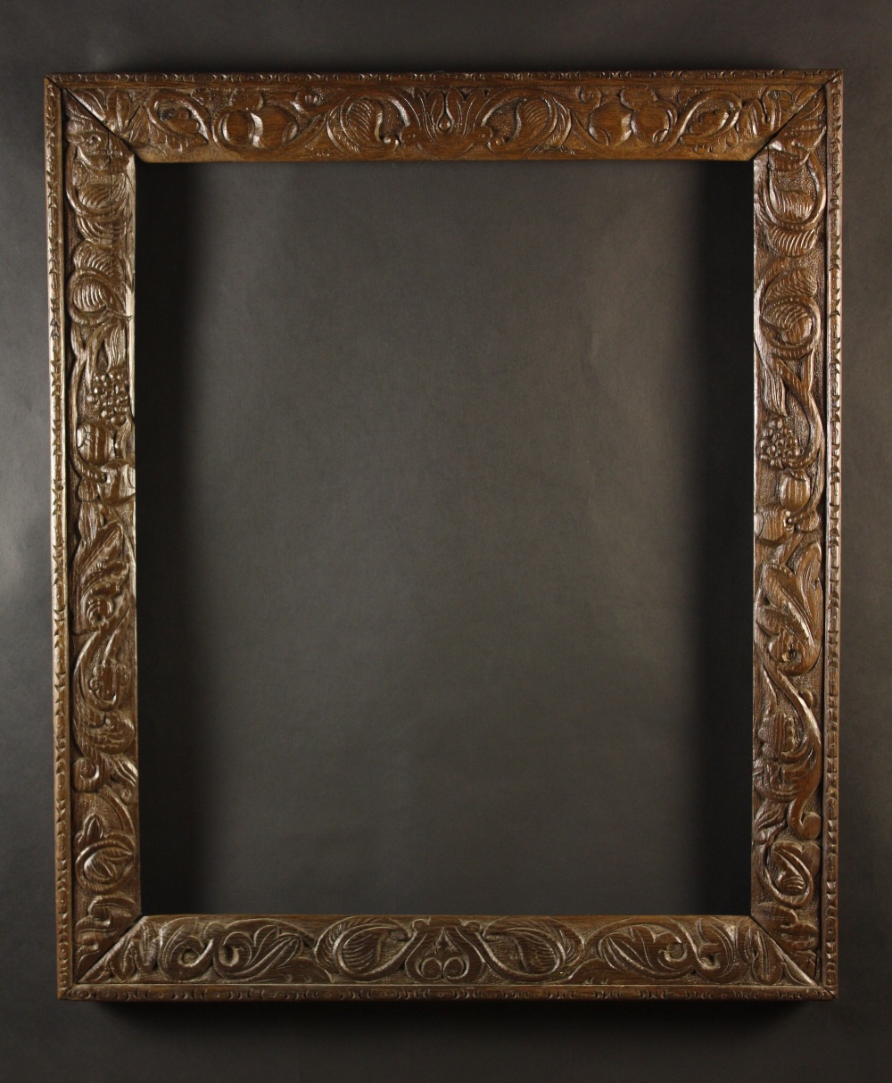 A 17th Century Carved Oak Frame enriched with scrolling foliage, 37¼ ins x 32 ins (94.5 cms x 81