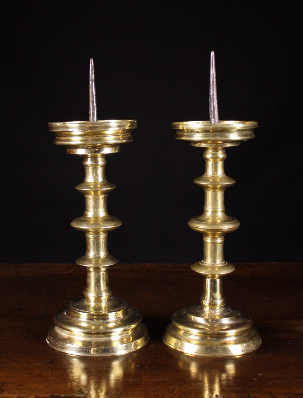 A Pair of Fine 16th Century Brass Blade Knopped Pricket Sticks, 17½ ins (45 cms) in height.