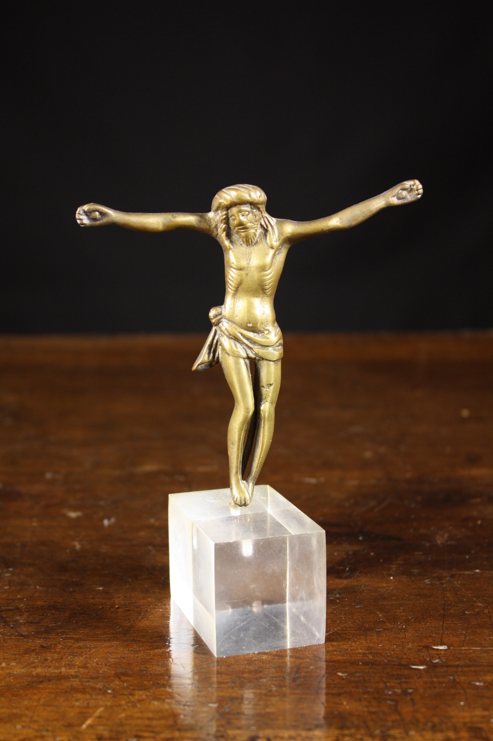 A 17th Century Bronze Figure of Christ Crucified, 4½ ins (11.5 cms) in height.
