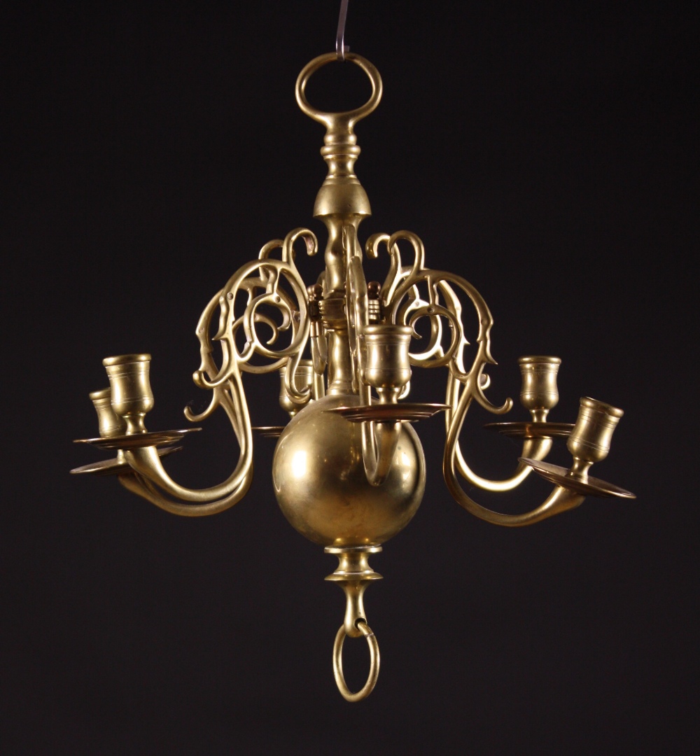 A Small Six Branch Brass Chandelier.  The crested S-scroll arms pegged onto the centre stem above