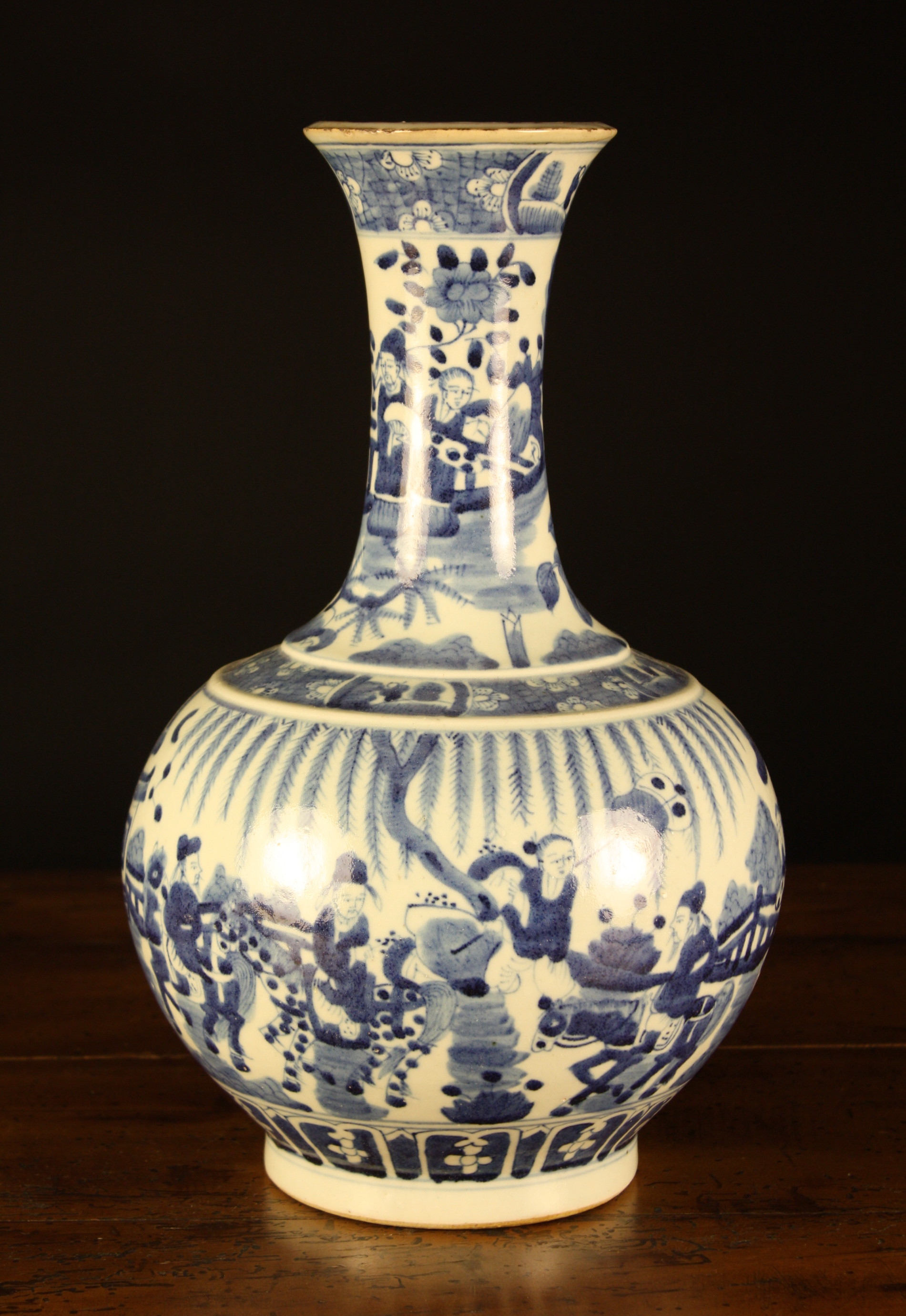 A Blue & White Chinese Baluster Vase depicting figures standing in a garden 15½ ins (39.5 cms) in