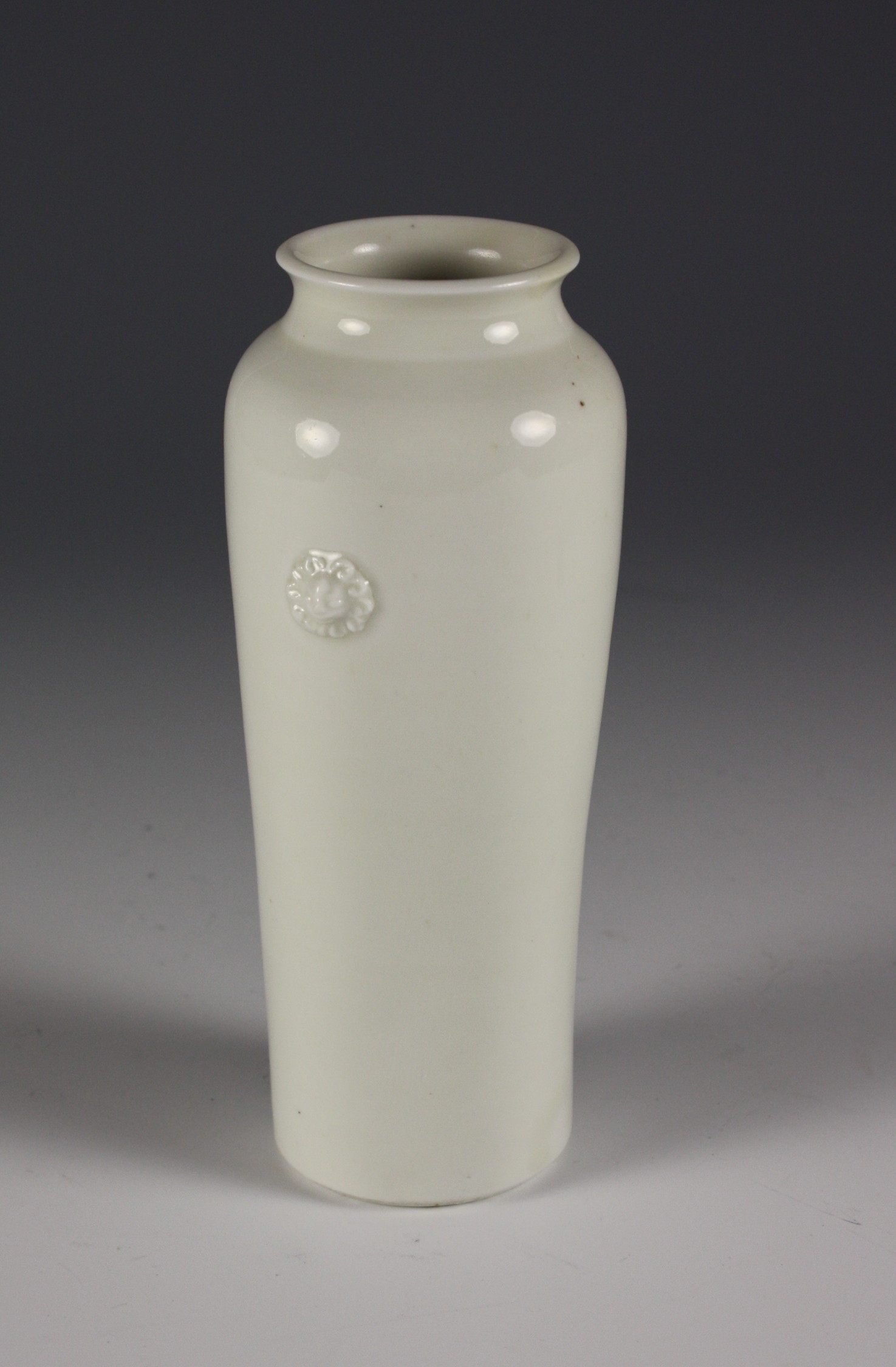 A Chinese Dehua Blanc-de-Chine Cylindrical Vase with small applied animal masks. 7¼ ins (18.5 cm)