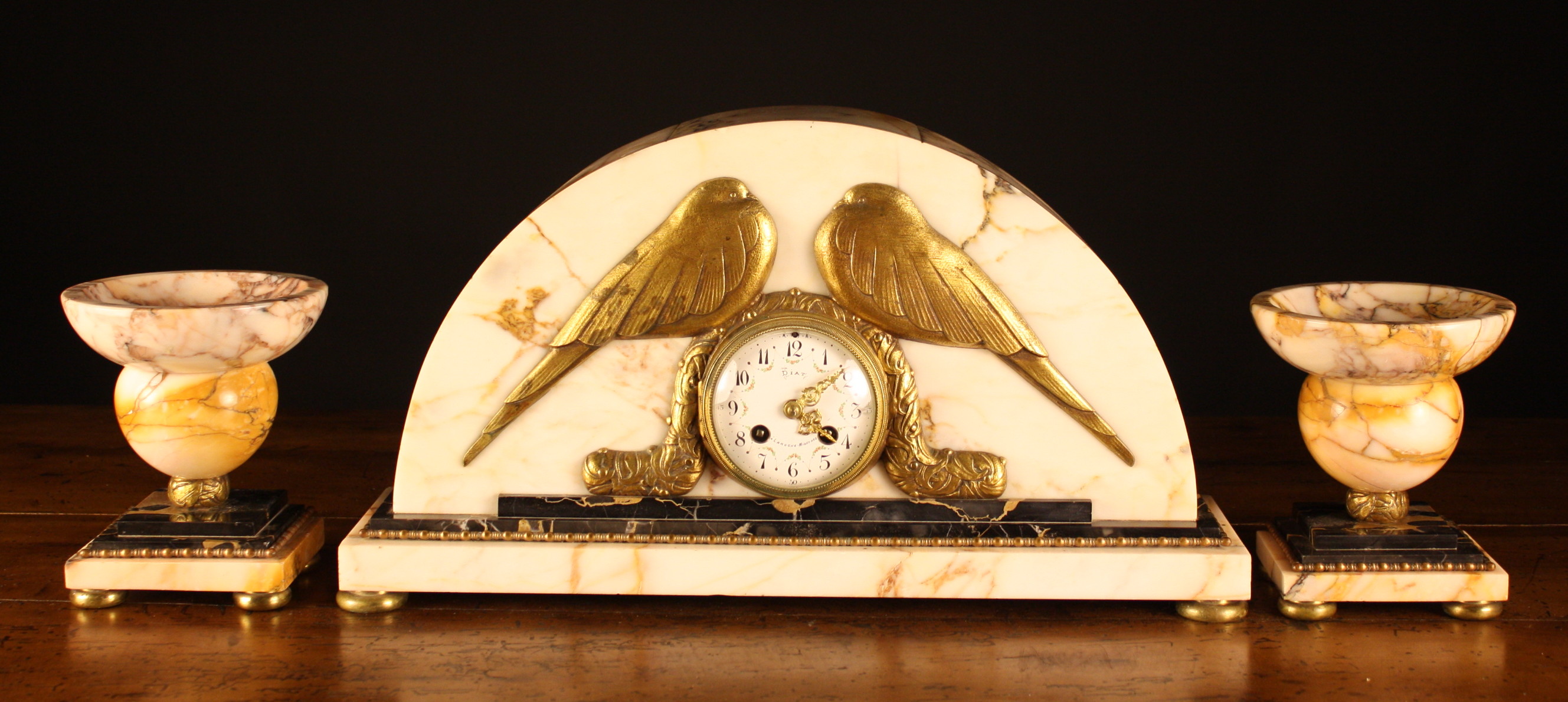 An Art Deco Marble Clock Set.  The clock dial signed DIAT LAROCHE-MIGENNES and set into a demi-