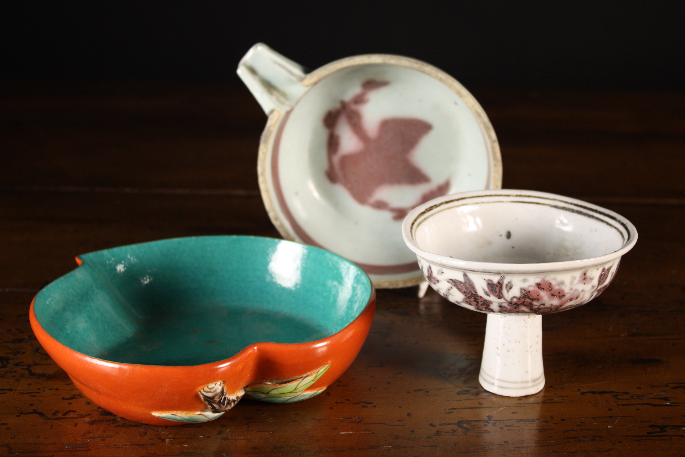 Three Chinese Ceramic Pieces: A stem cup 3¼ ins (8 cms) high, a spouted dish 2 ins (5 cms) high,