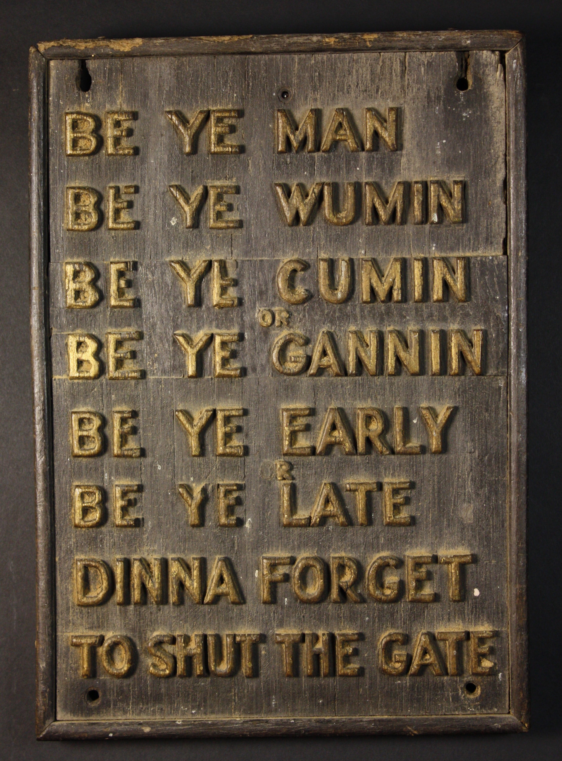 A Wooden Wall Plaque, carved in relief  from the solid with a notice written in a Northern