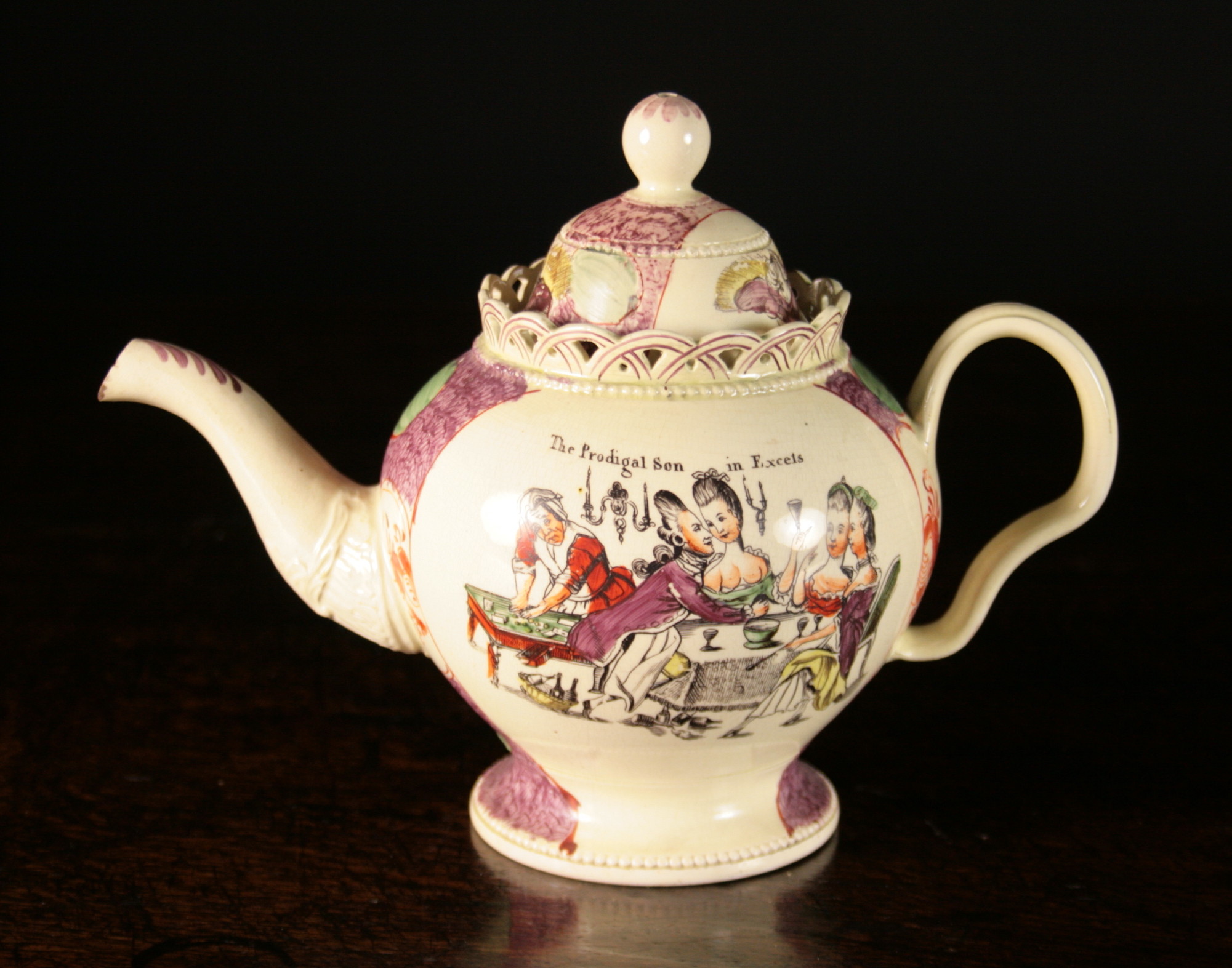 A William Greatbatch Creamware Teapot with pierced gallery rim.  The baluster body printed in