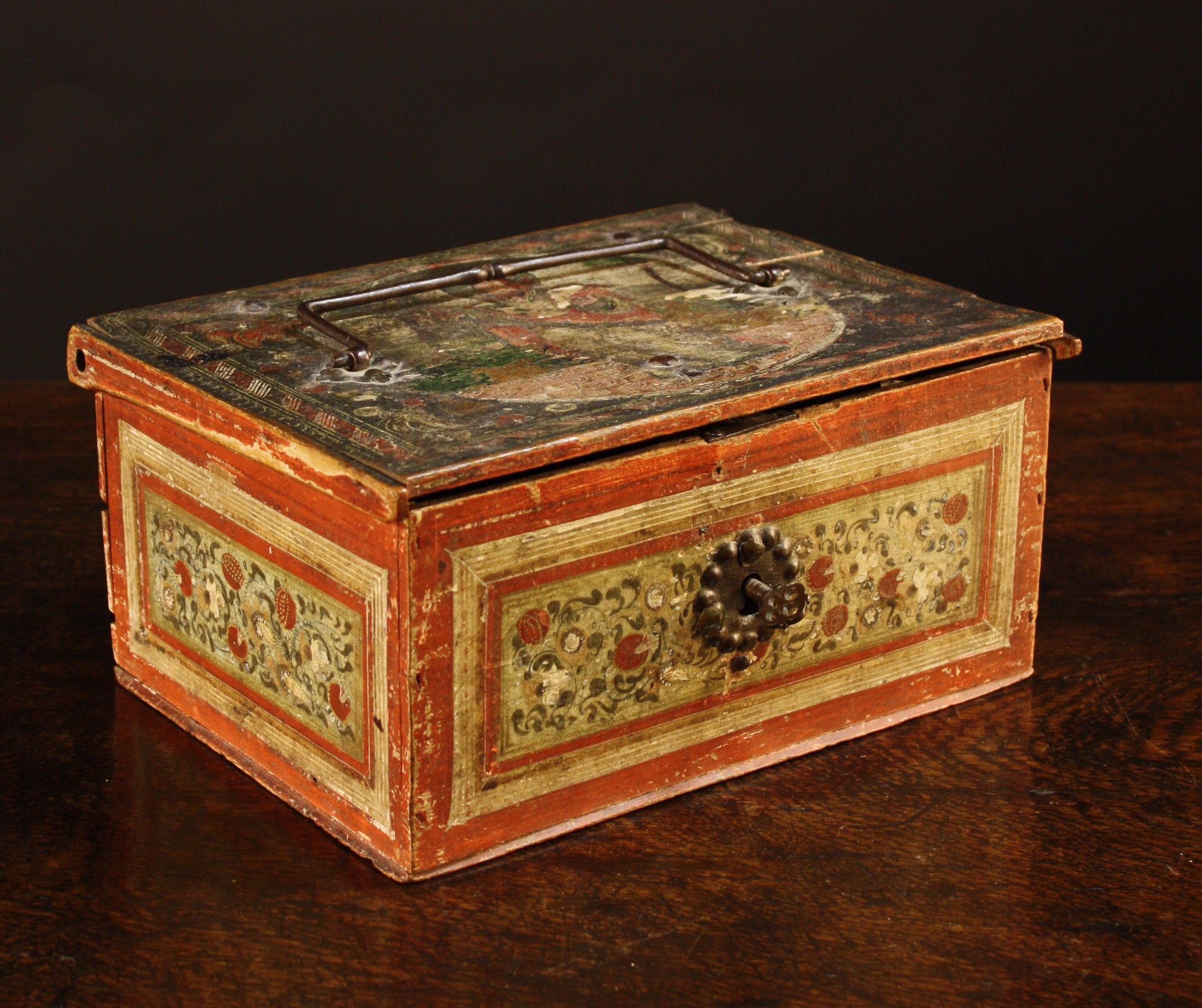 An 18th Century Painted German Box.  The lid on strap hinges decorated with a depiction of Christ in