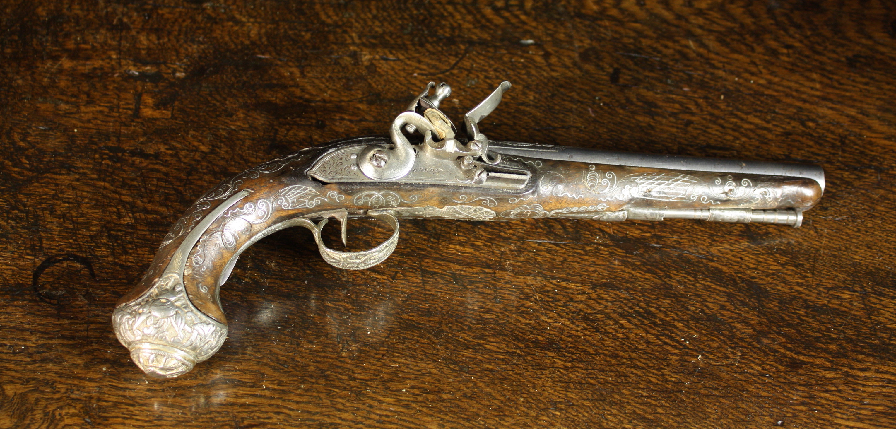 An 18th Century English Flintlock Pistol for the Persian Market engraved and inlaid with intricate