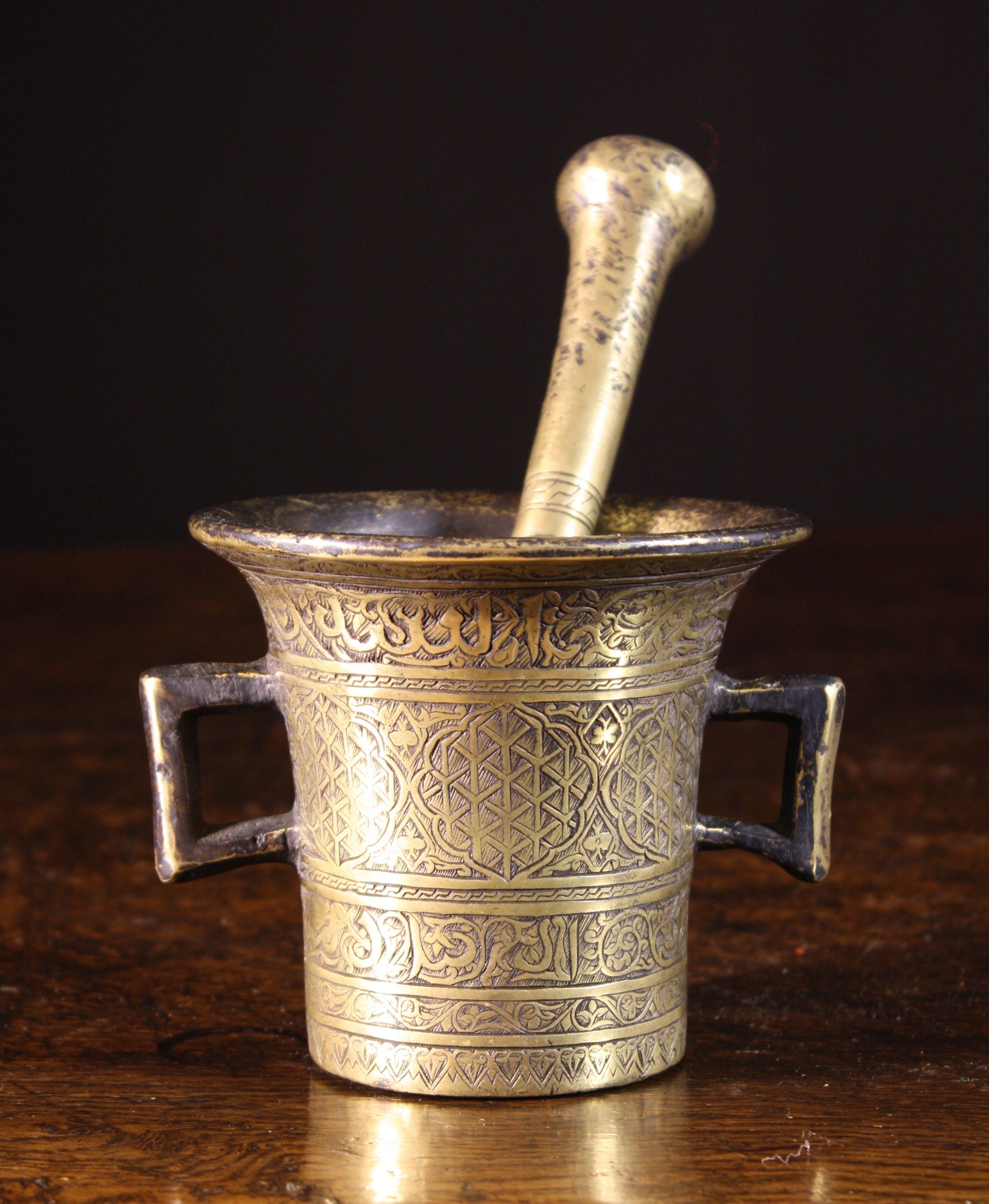 An 18th Century Mortar with engraved Indo-Persian decoration and bands of script, The flared body 4¼