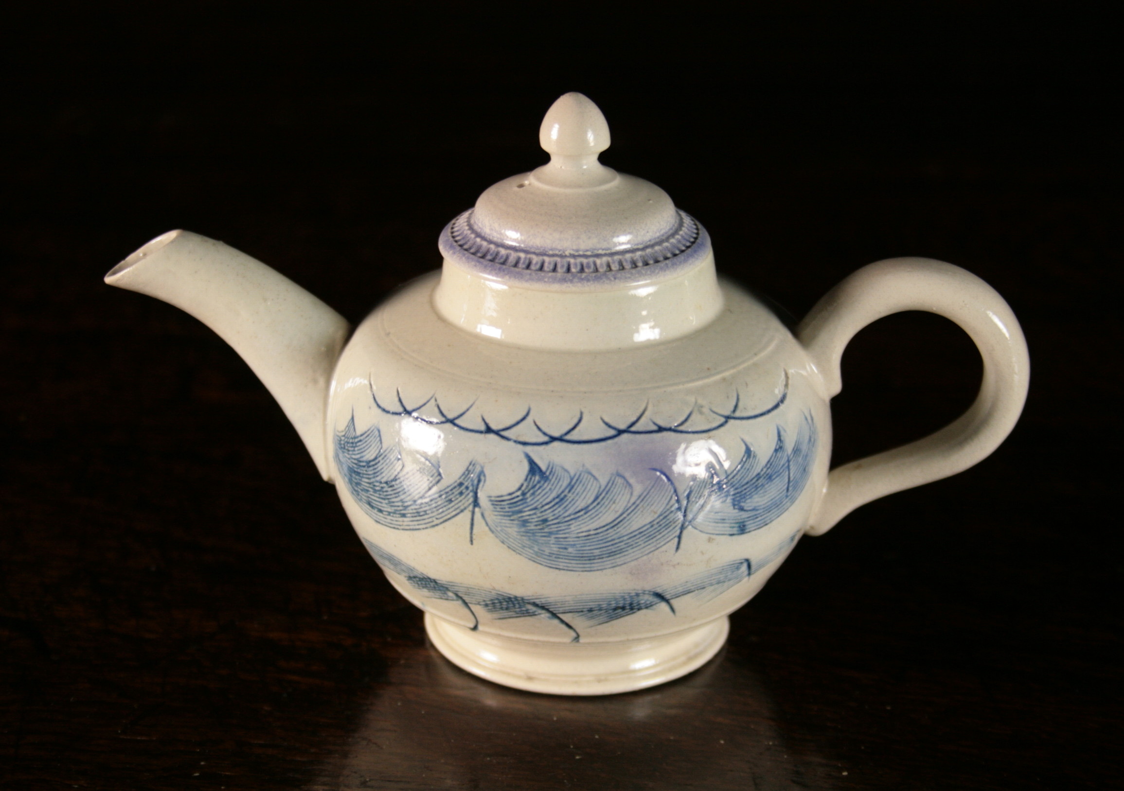 A Small English Salt-glazed Teapot Circa ,1755 with blue scratch decoration, 4 ins (10 cms) in