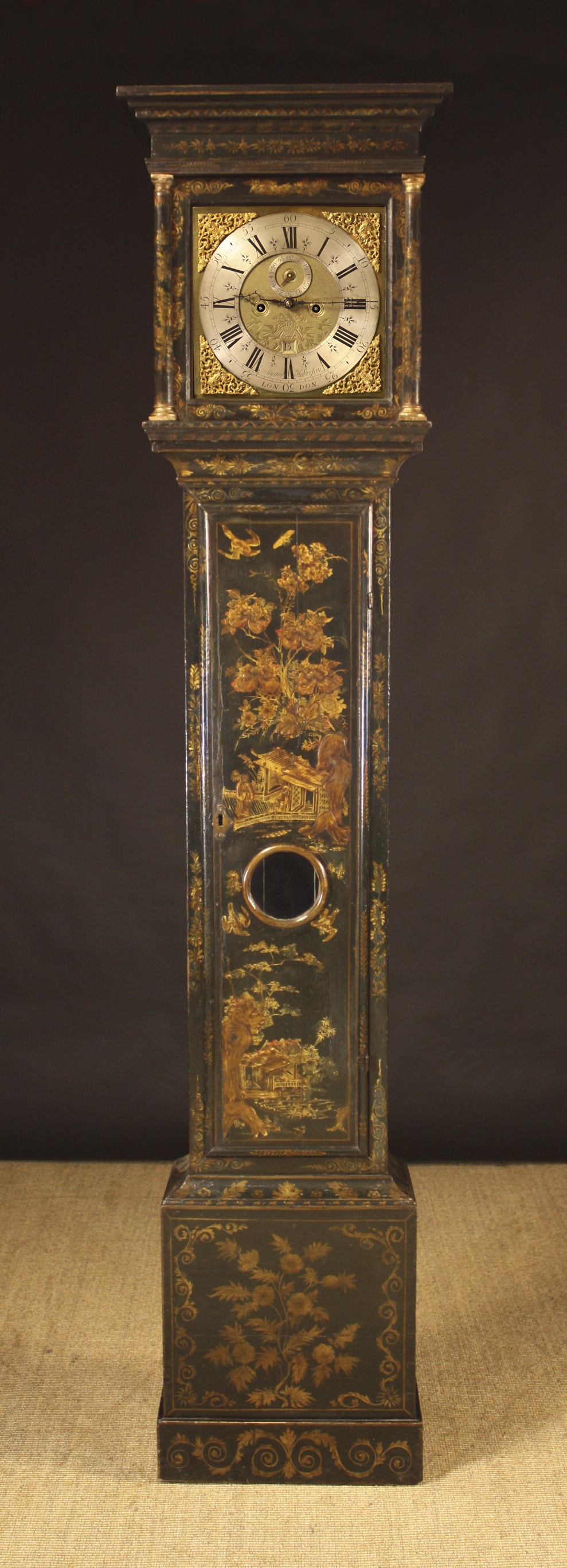 An 18th Century Eight Day Japanned Longcase Clock.  The 11¾ inch (30 cm) square brass dial with