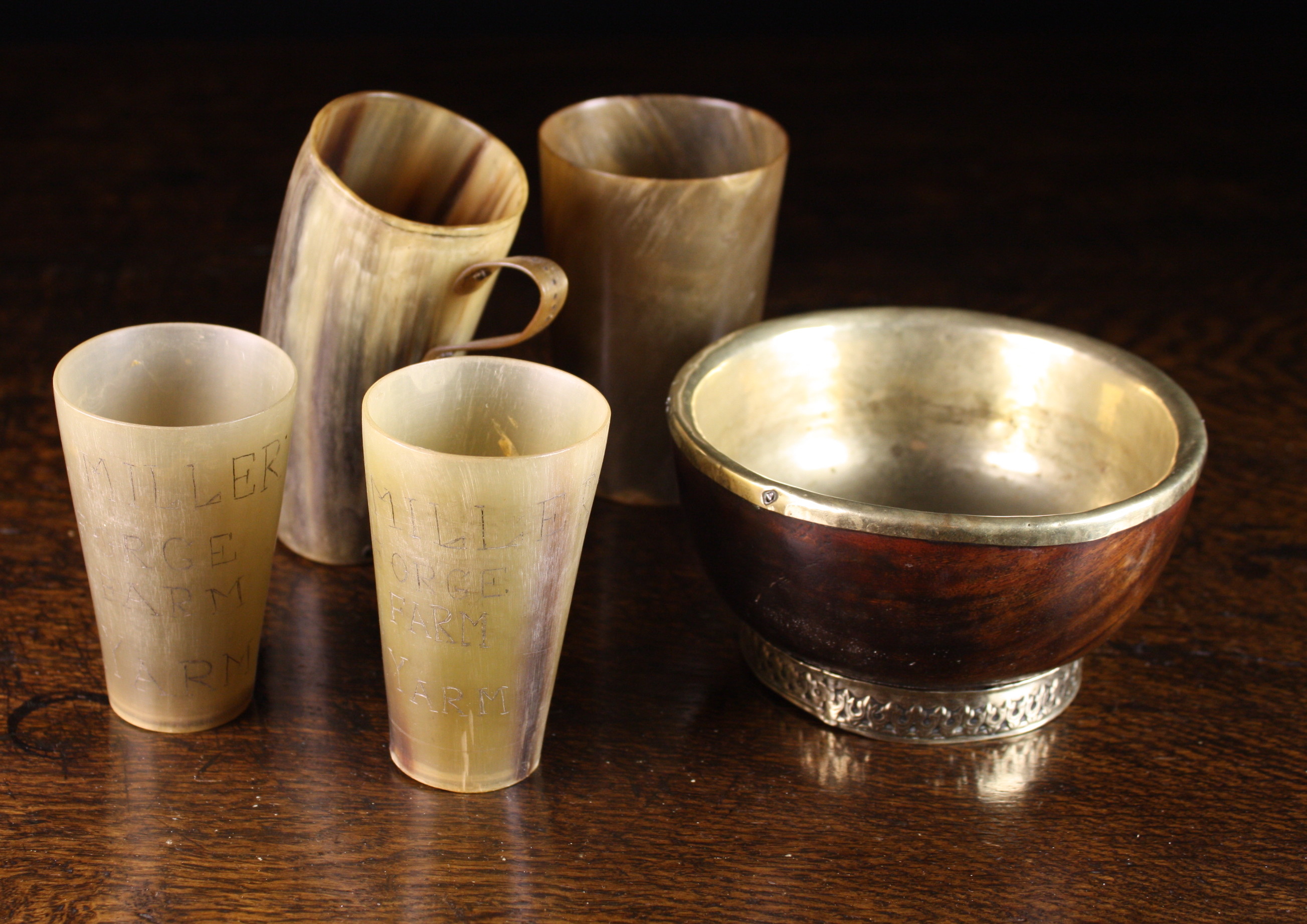 Four Horn Beakers and a Turned Treen Maiser with silvered metal foot and lining, 3 ins (7.5 cms)