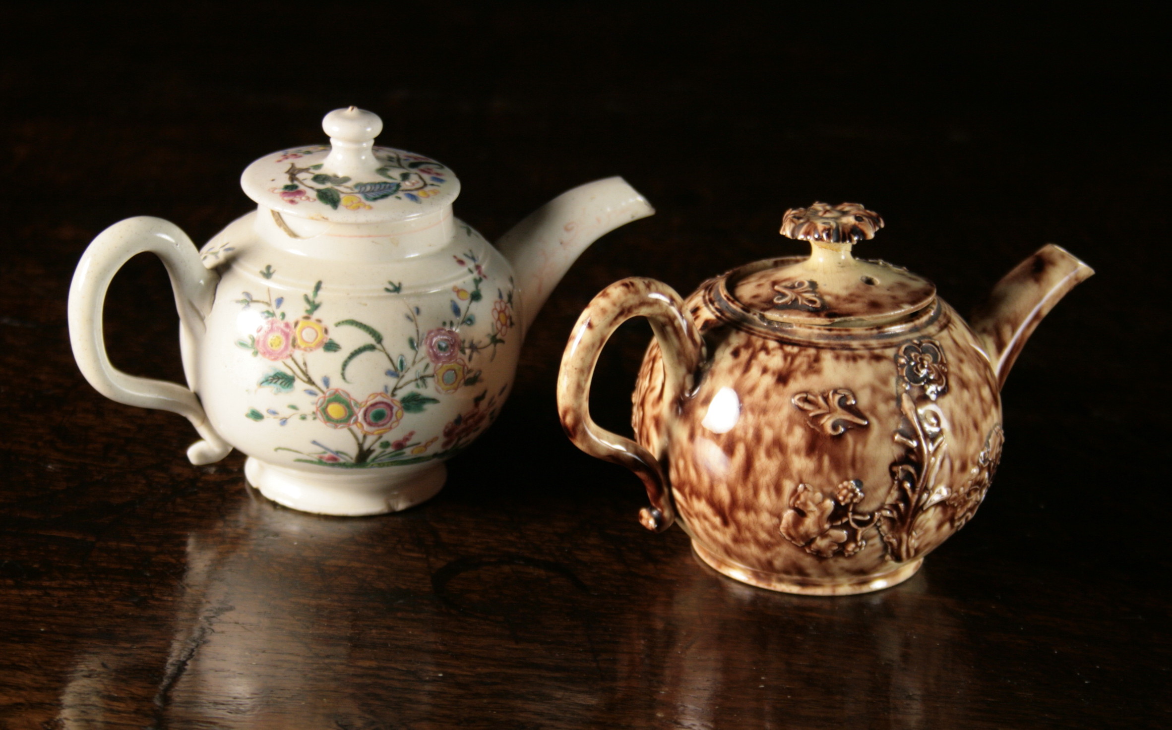 Two Miniature 18th Century Teapots: A Wheildon example, sprigged with flowering plants, 2¾ ins (7