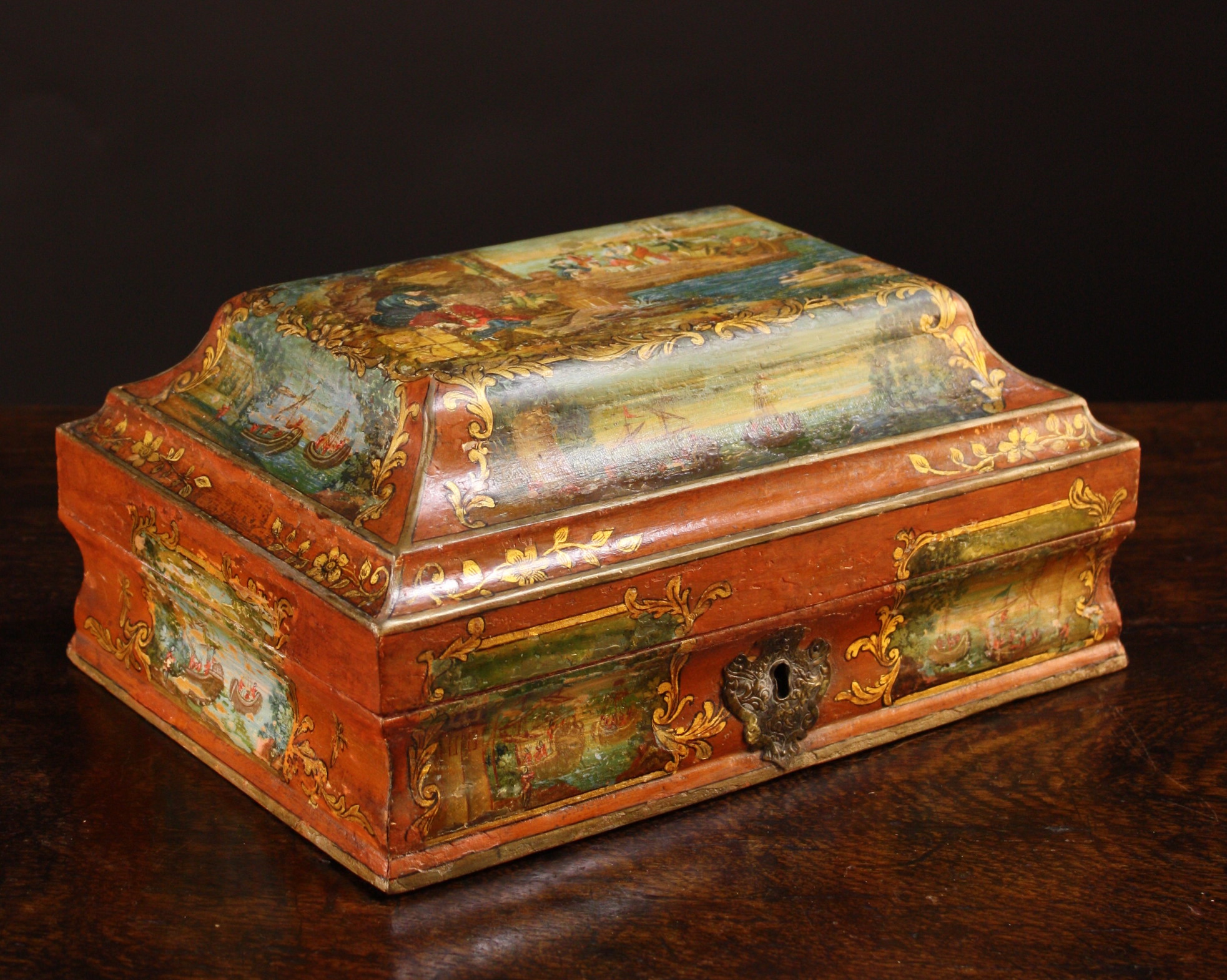 An 18th Century Painted Box.  The box with caddy-moulded top depicting quayside scene with