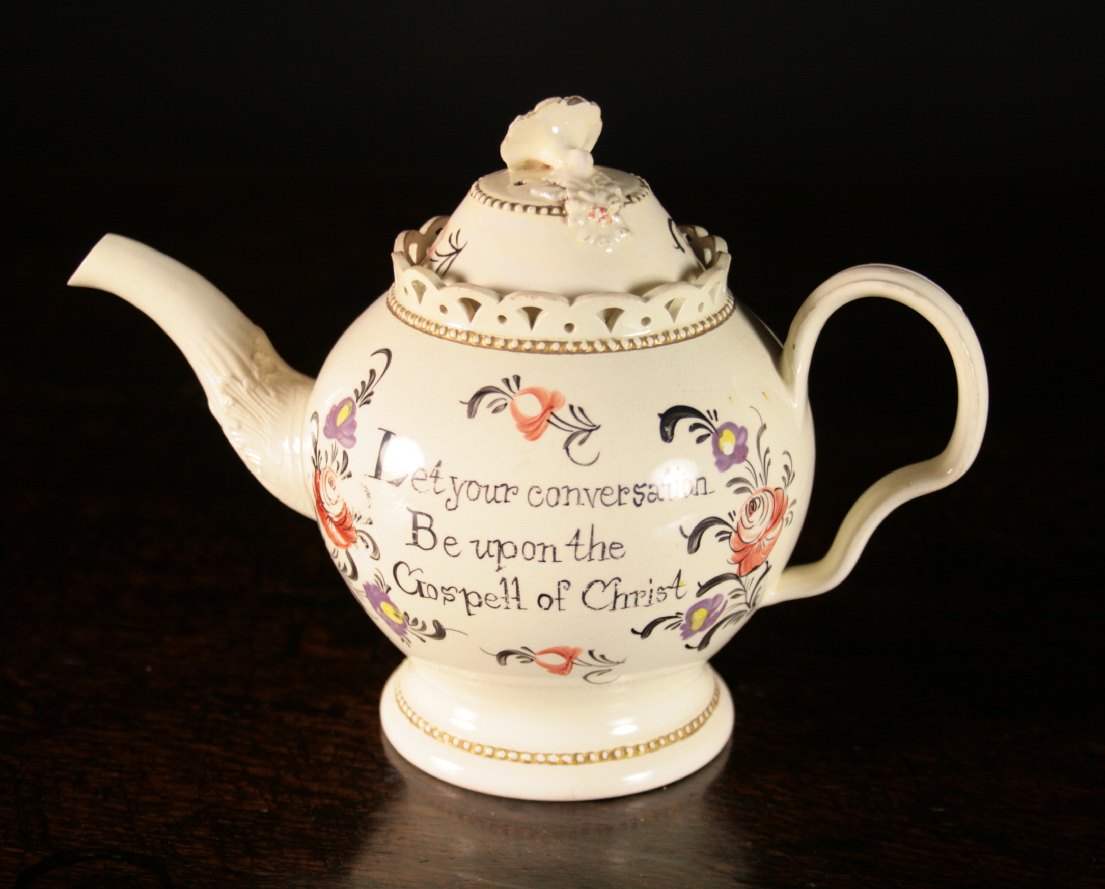 An 18th Century Creamware Teapot, probably William Greatbatch.  The baluster body with a pierced