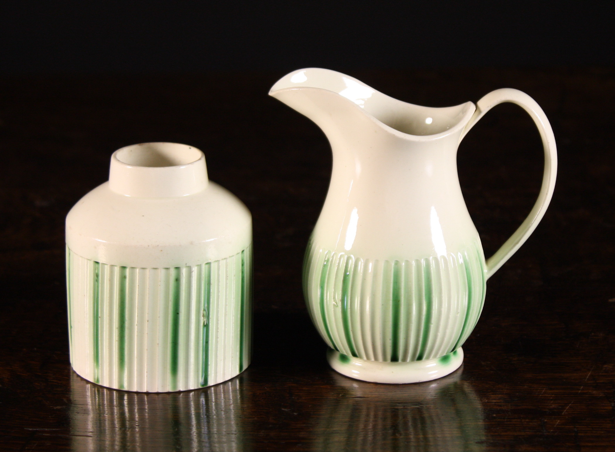 An 18th Century  Leeds Creamware Tea Caddy & Jug, Circa 1770; the round semi-fluted bodies decorated