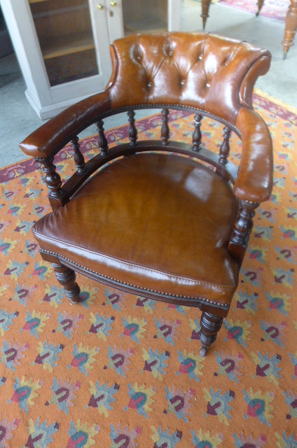 A good Victorian mahogany library chair re-upholstered in brown leather with spindle back and turned