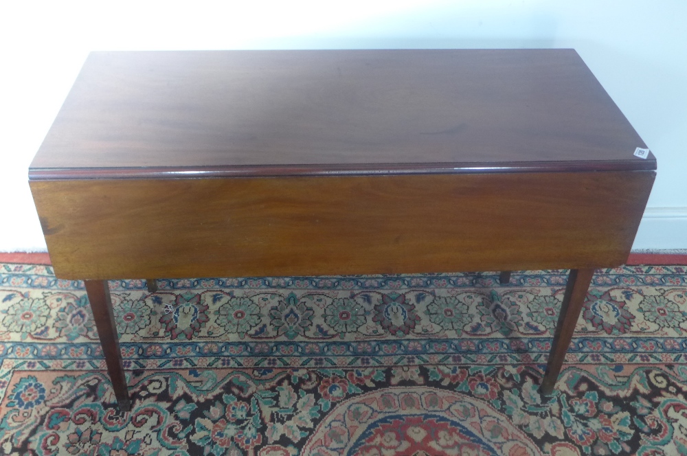 A mahogany drop leaf Pembroke table on square tapering legs 1.08m x 90cm