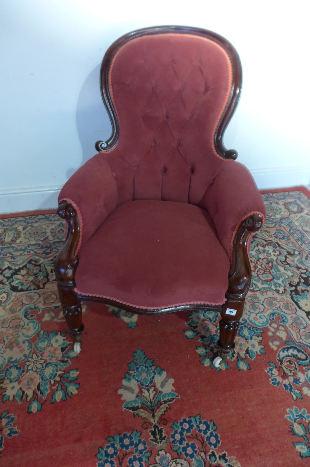 A 19th century mahogany framed spoon back armchair on reeded legs Condition report: Recently