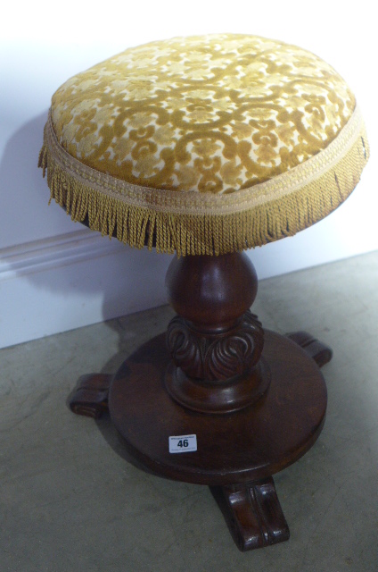 A 19th century mahogany revolving stool