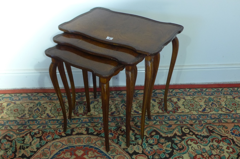 A nest of three burr elm occasional tables