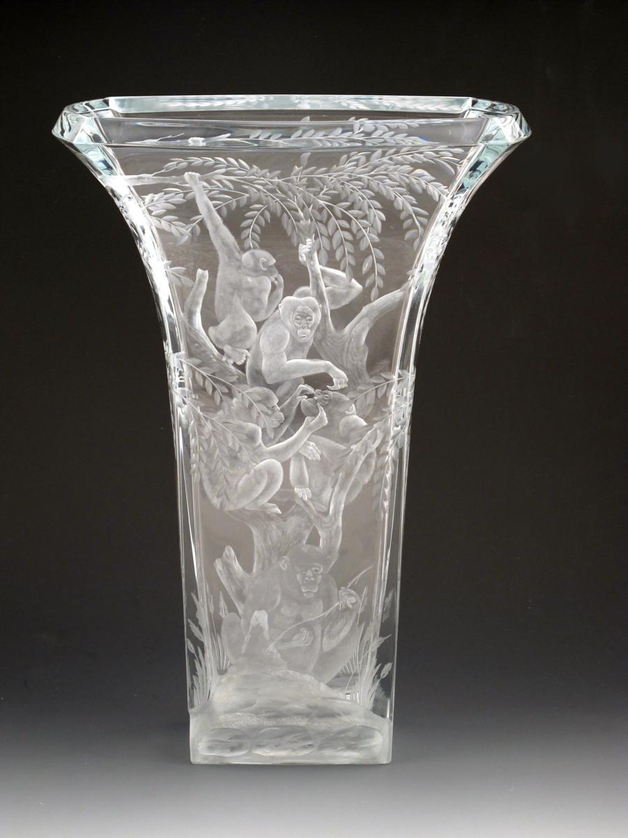 A large Baccarat engraved glass vase, flaring, rectangular section, engraved to both sides with a