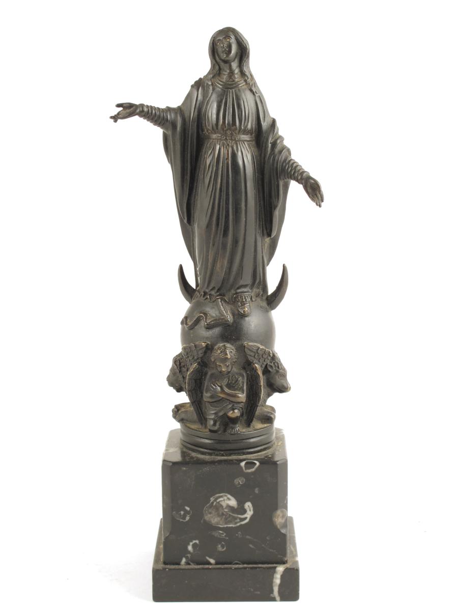 A 19th century bronze figure of the Virgin Mary, standing on a globe with figures of the four