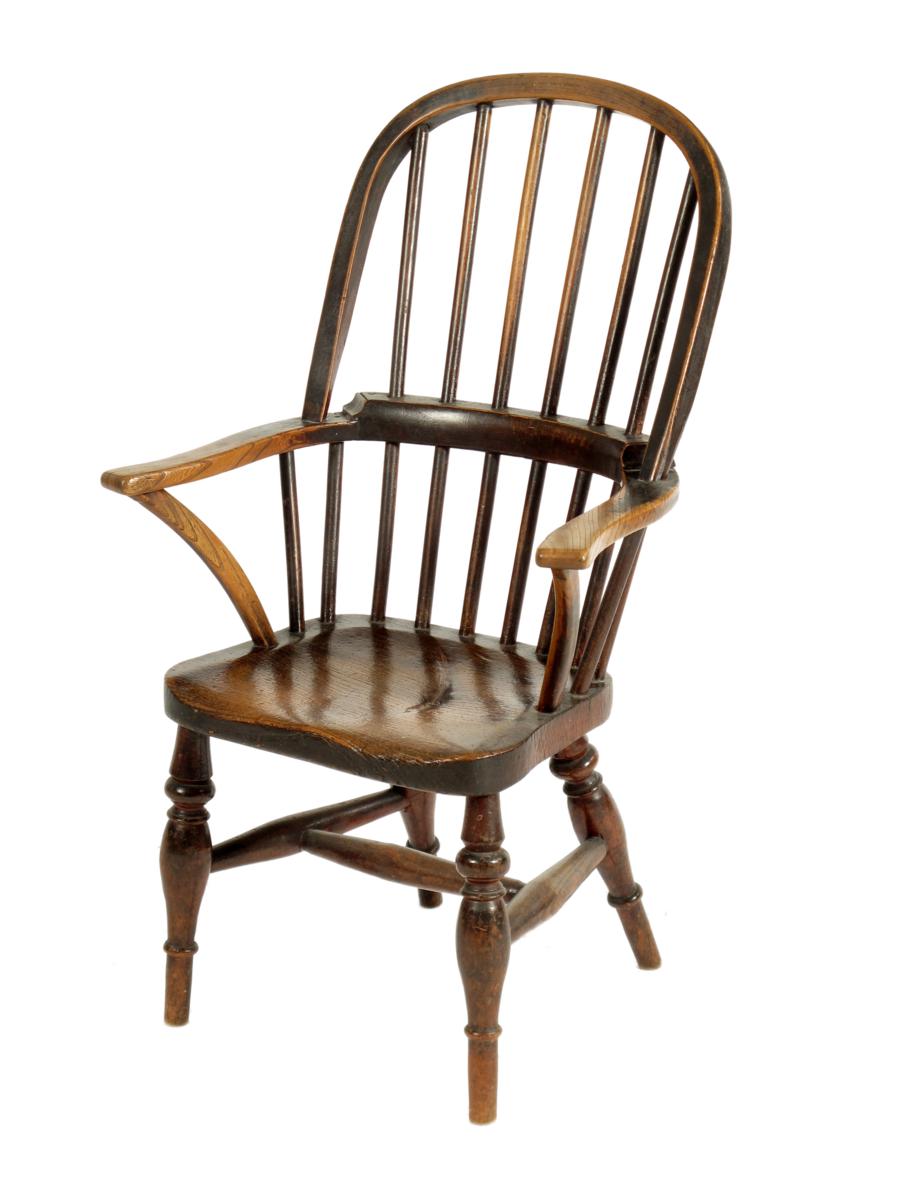 A 19th century beech, ash and elm child`s Windsor armchair. Sold on behalf of the executors of The