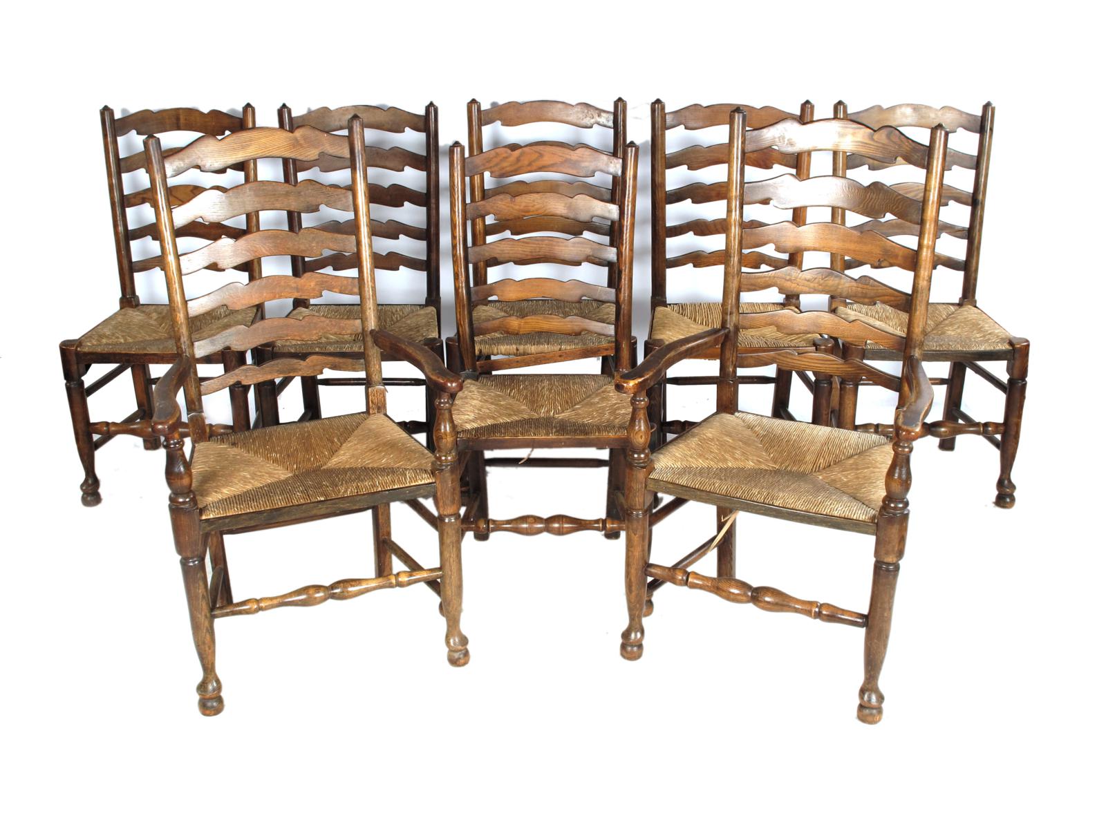 A harlequin set of eight ash Lancashire ladderback dining chairs, with rush seats, comprising: a