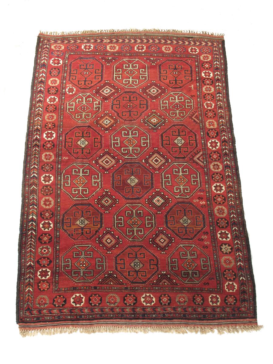 An Afghan rug, 119 x 78½in (302 x 199.5cm).