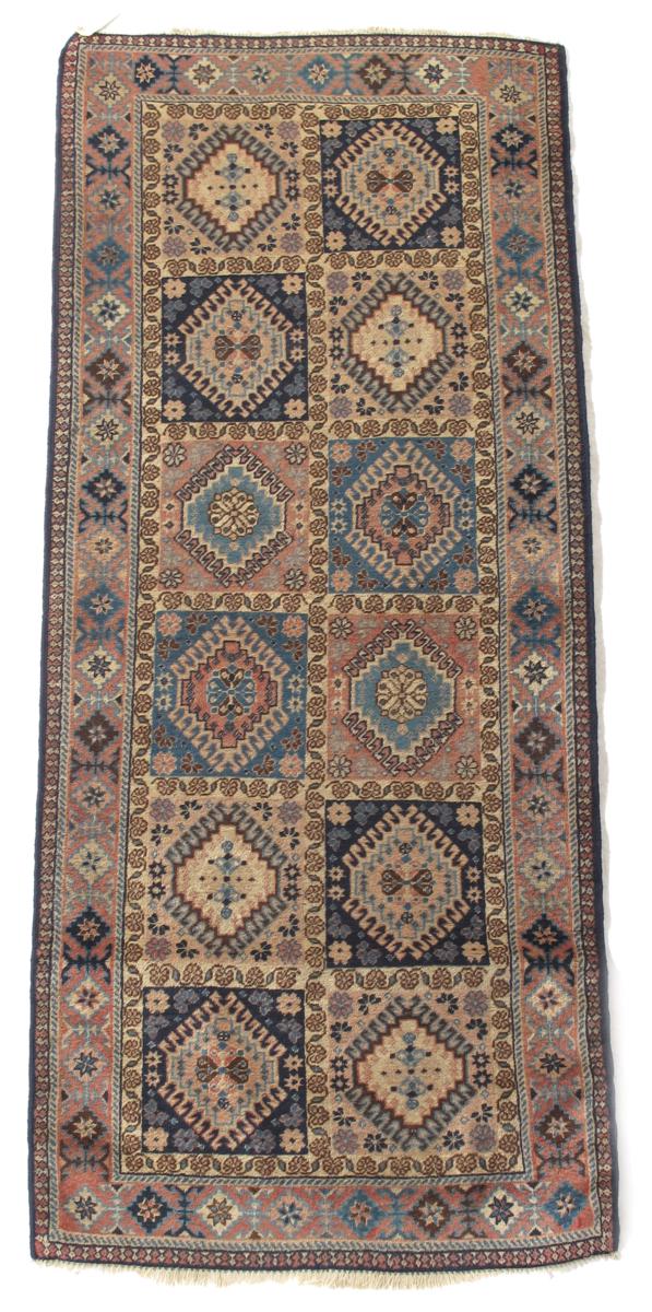 A Yalameh long rug, Fars, south west Persia, early 20th century, 77½ x 31in (197 x 81cm).