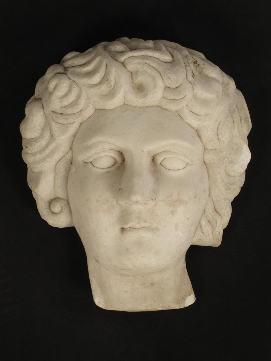 A carved white marble relief bust, 17?in (45.3cm) high, 15?in (38.7cm) wide.