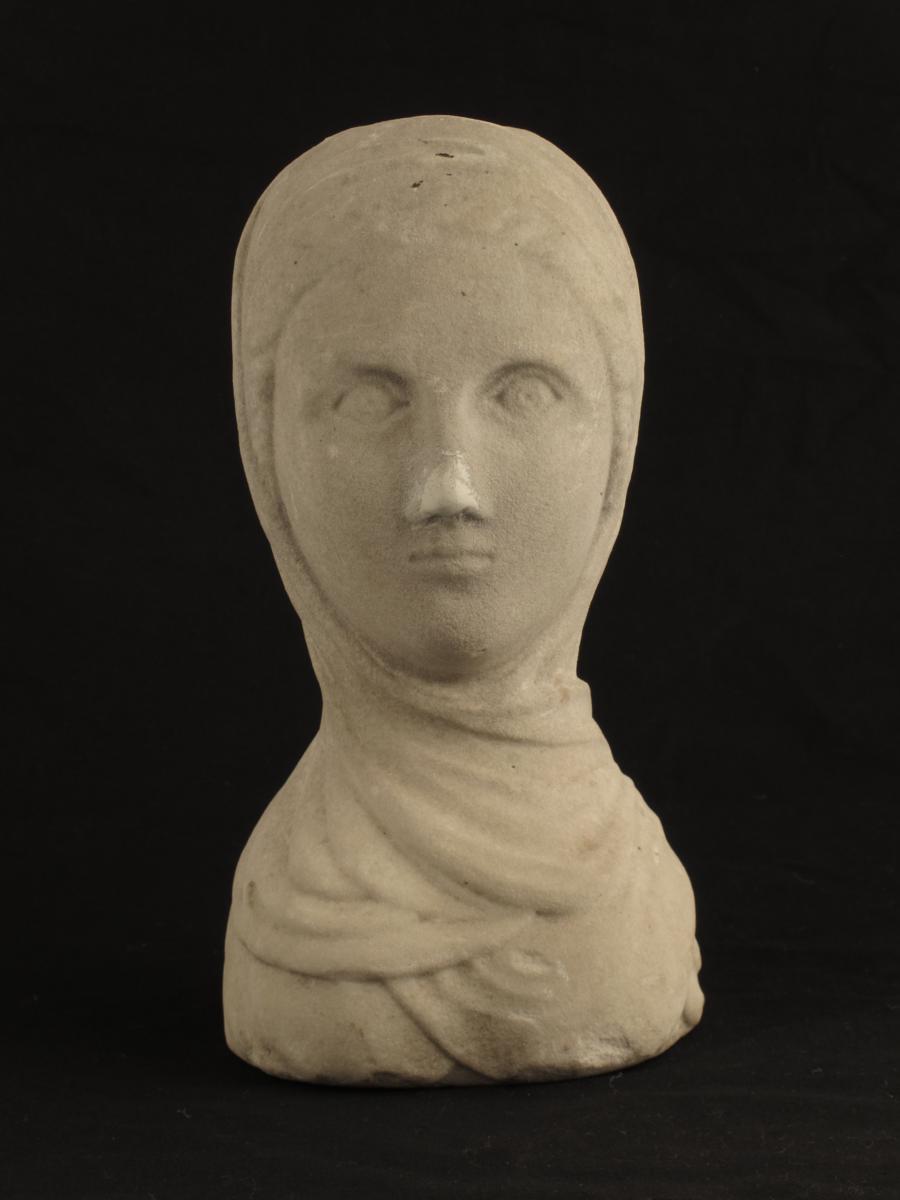 A Roman marble bust of a lady, 9½in (23.7cm) high, 5in (12.5cm) wide.