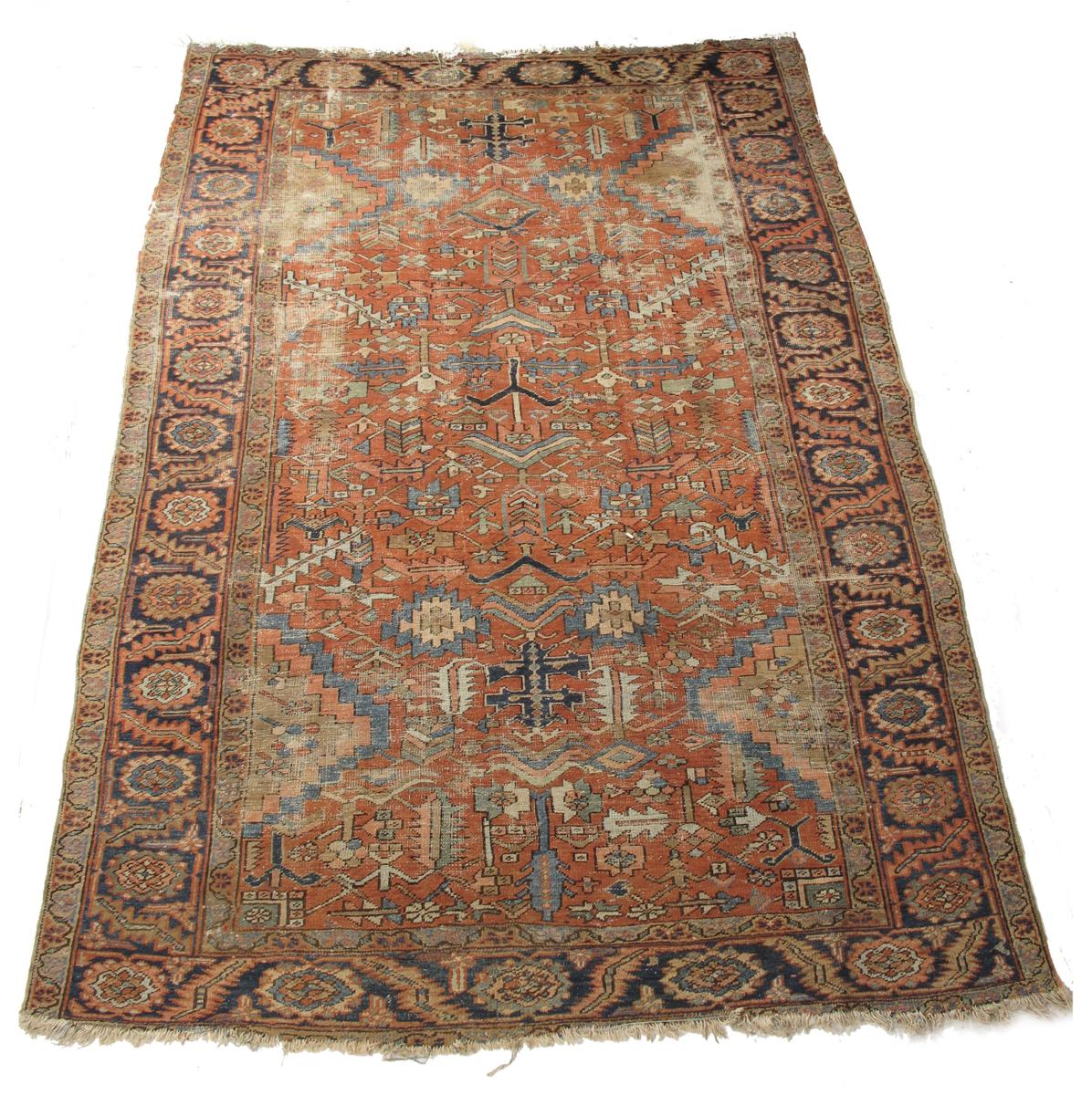 A Heriz carpet, north west Persia, early 20th century, 137 x 103in (348 x 262cm).