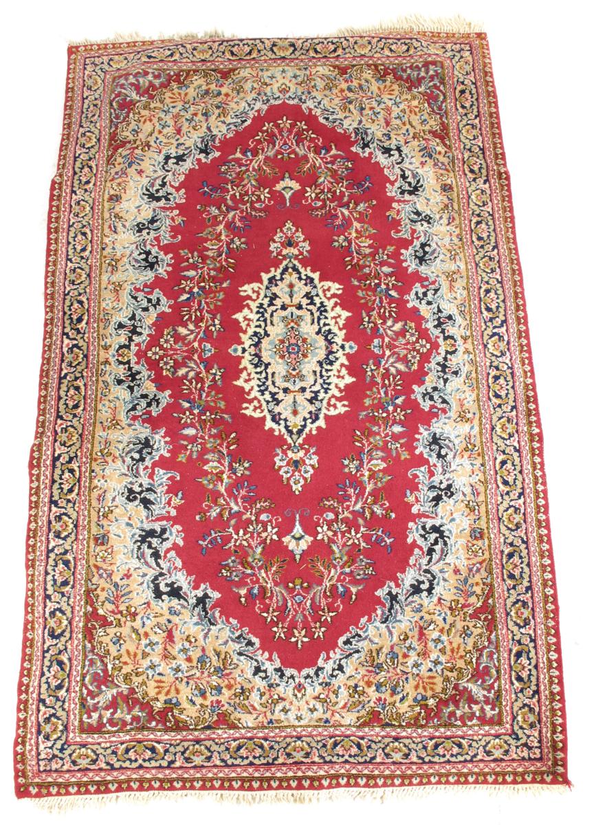 A Kerman area rug, south west Persia, modern, with a sewn on backing, 82 x 50in (209 x 127cm).
