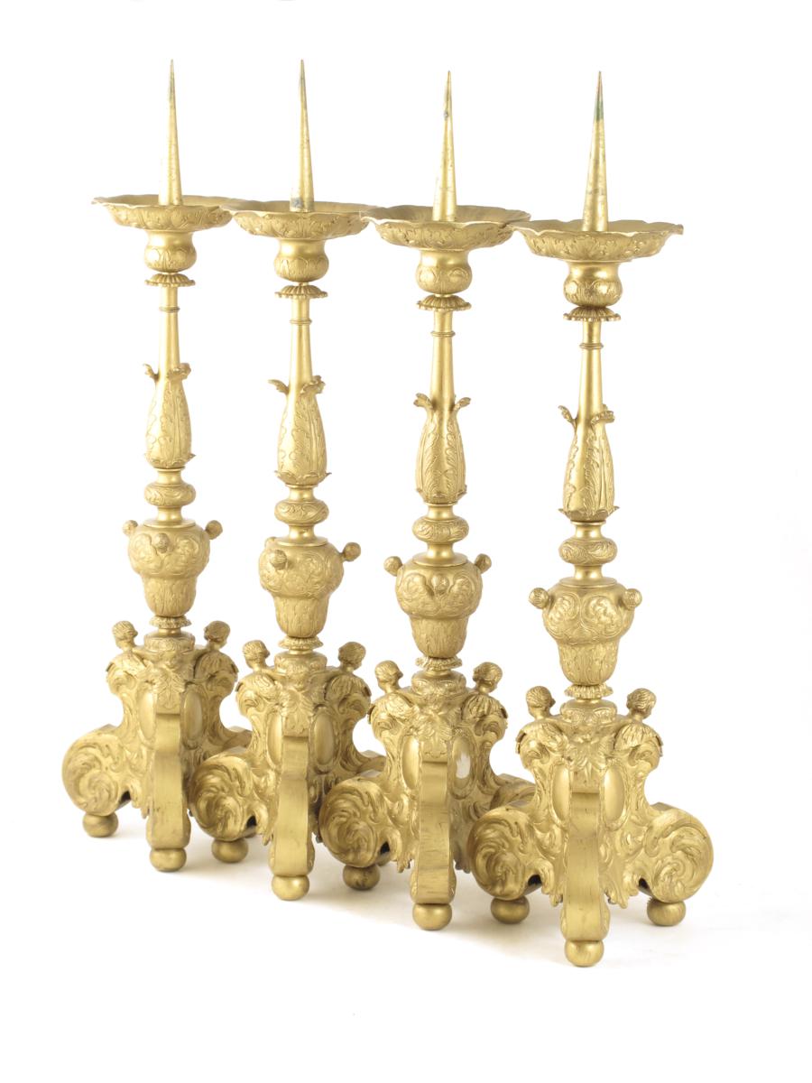 A set of four 19th century French ormolu pricket altar candlesticks in early 18th century style,