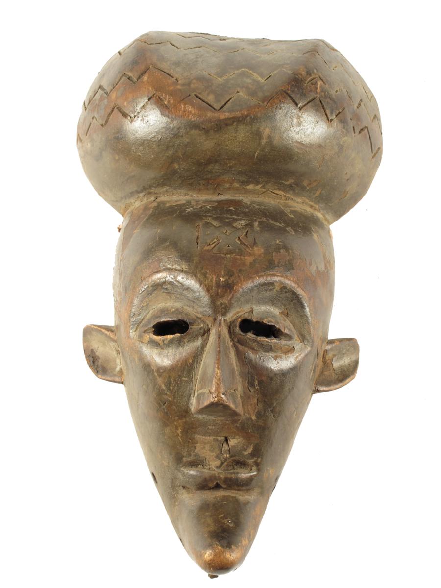 A Congo mask, with domed coiffure and scarifications, 12?in (32.4cm) high.