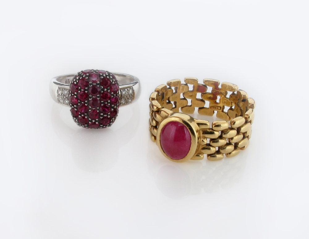 A ruby and diamond bombé ring, the oval shaped centre section pavé set with circular cut rubies,