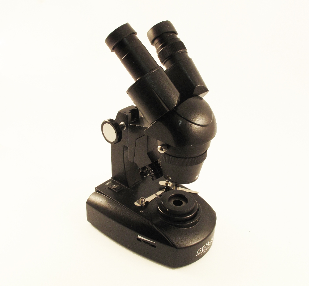 A Travel Gem microscope, with fitted metal travel case and instructions.