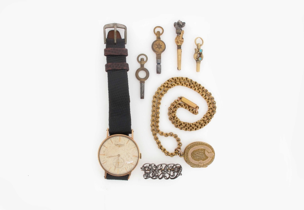 A gold wristwatch by Longines, on leather band, a small 19th century watch key, a diamond set brooch