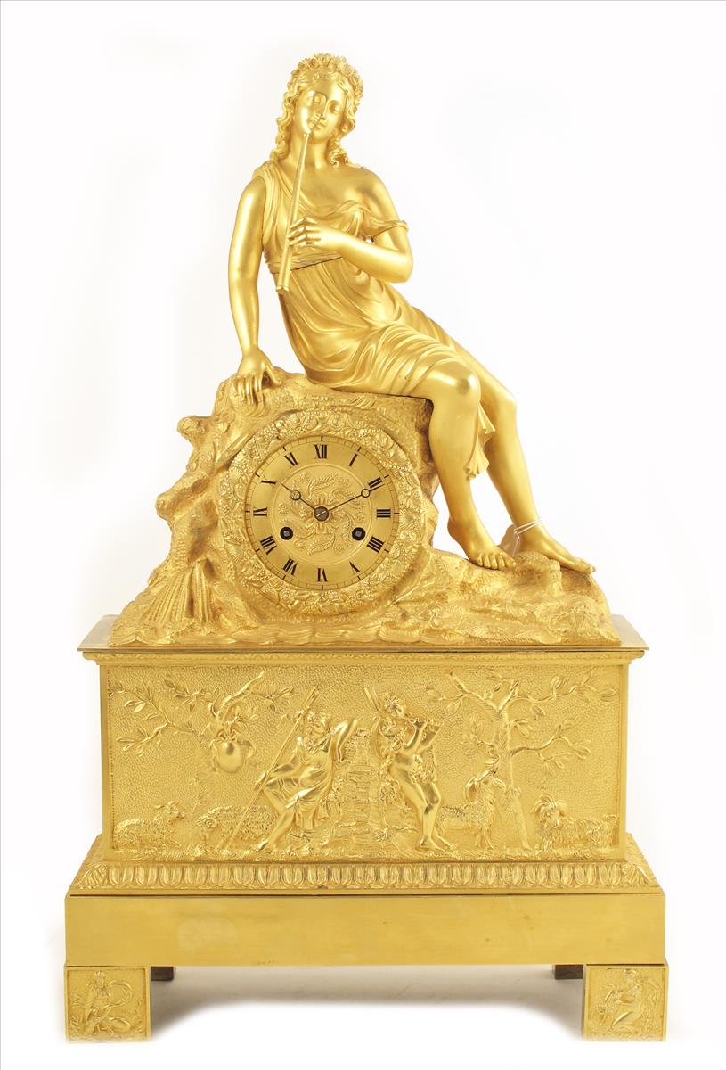 A Charles X ormolu mantel clock, suspension movement numbered 212 in a case formed as a rocky