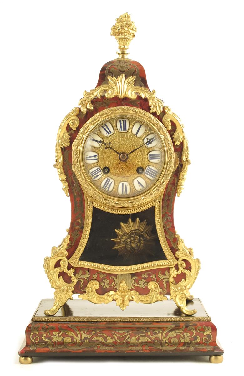 A French boulle mantel clock and plinth, embossed gilt dial with white enamel numeral reserves, in a