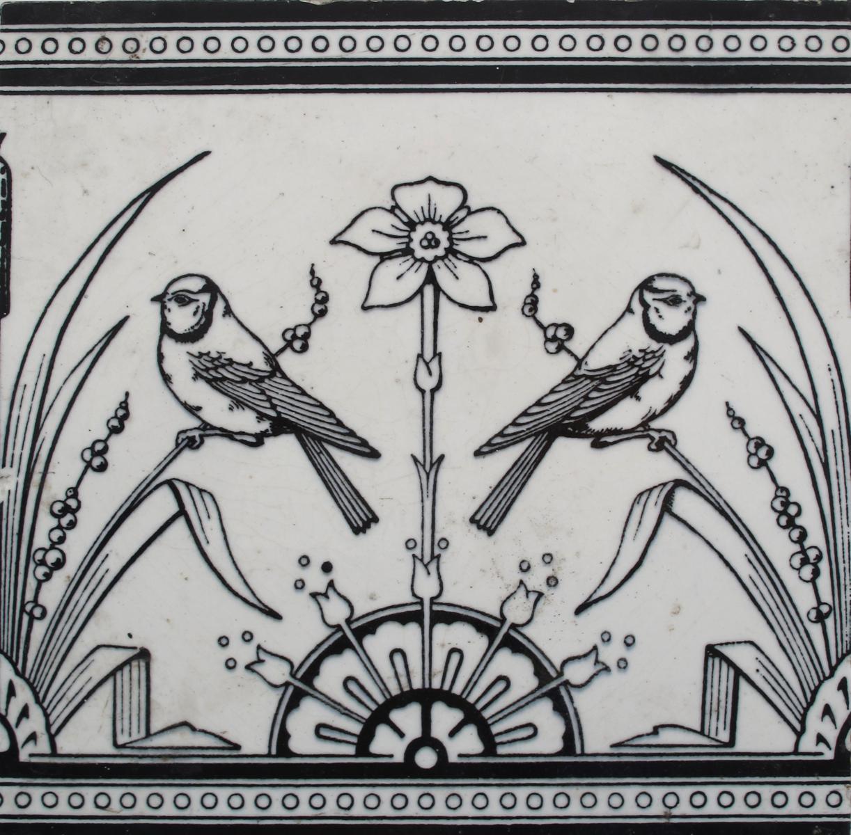 A Minton`s Pottery tile designed by Dr Christopher Dresser, printed in black with birds flanking a