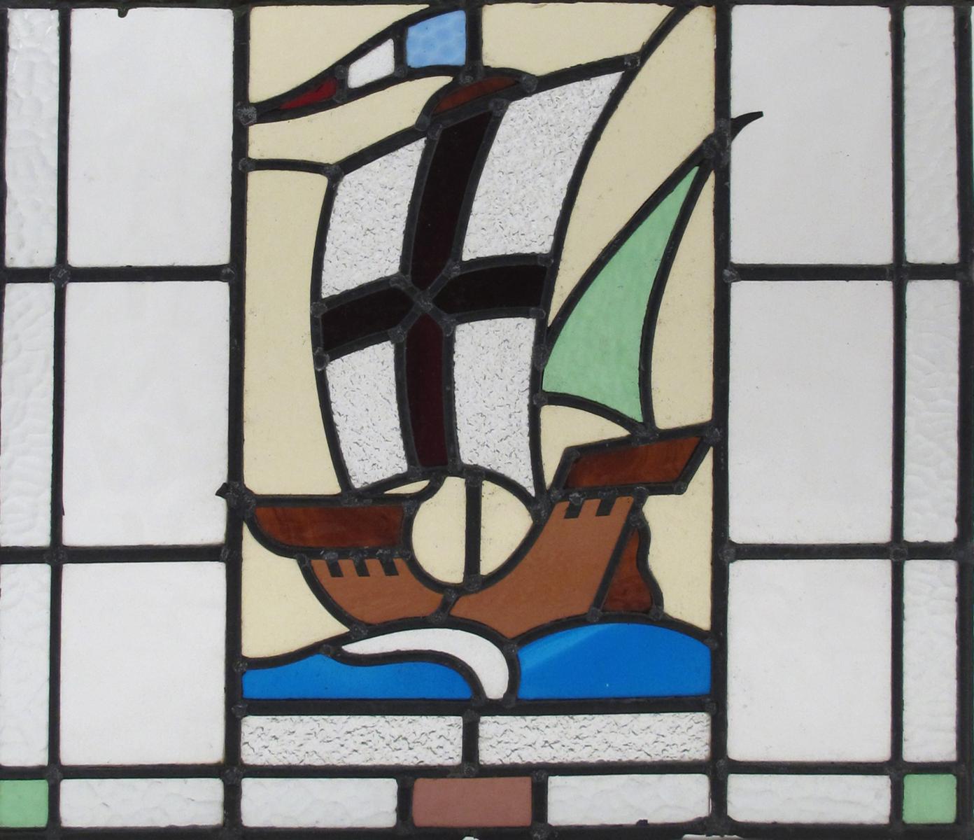 An Arts and Crafts leaded glass window, rectangular, decorated with a boat at full sail, 53 x 47cm.