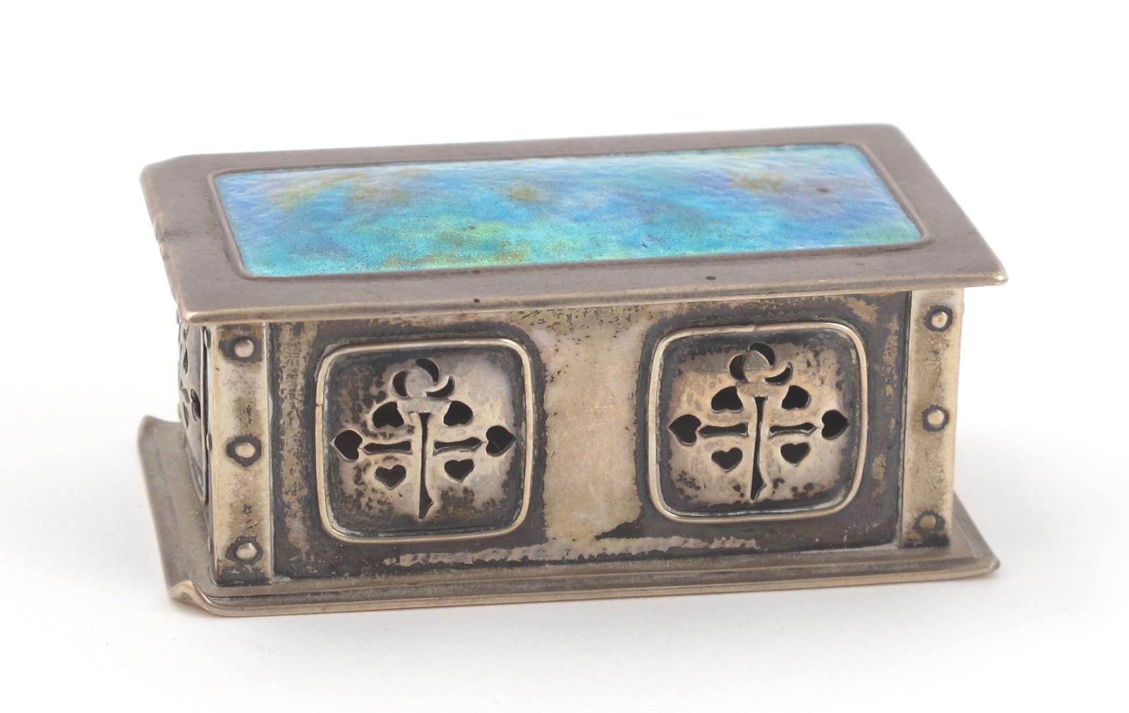 A small Liberty Cymric silver and enamel box and cover, the rectangular box with pierced foliate