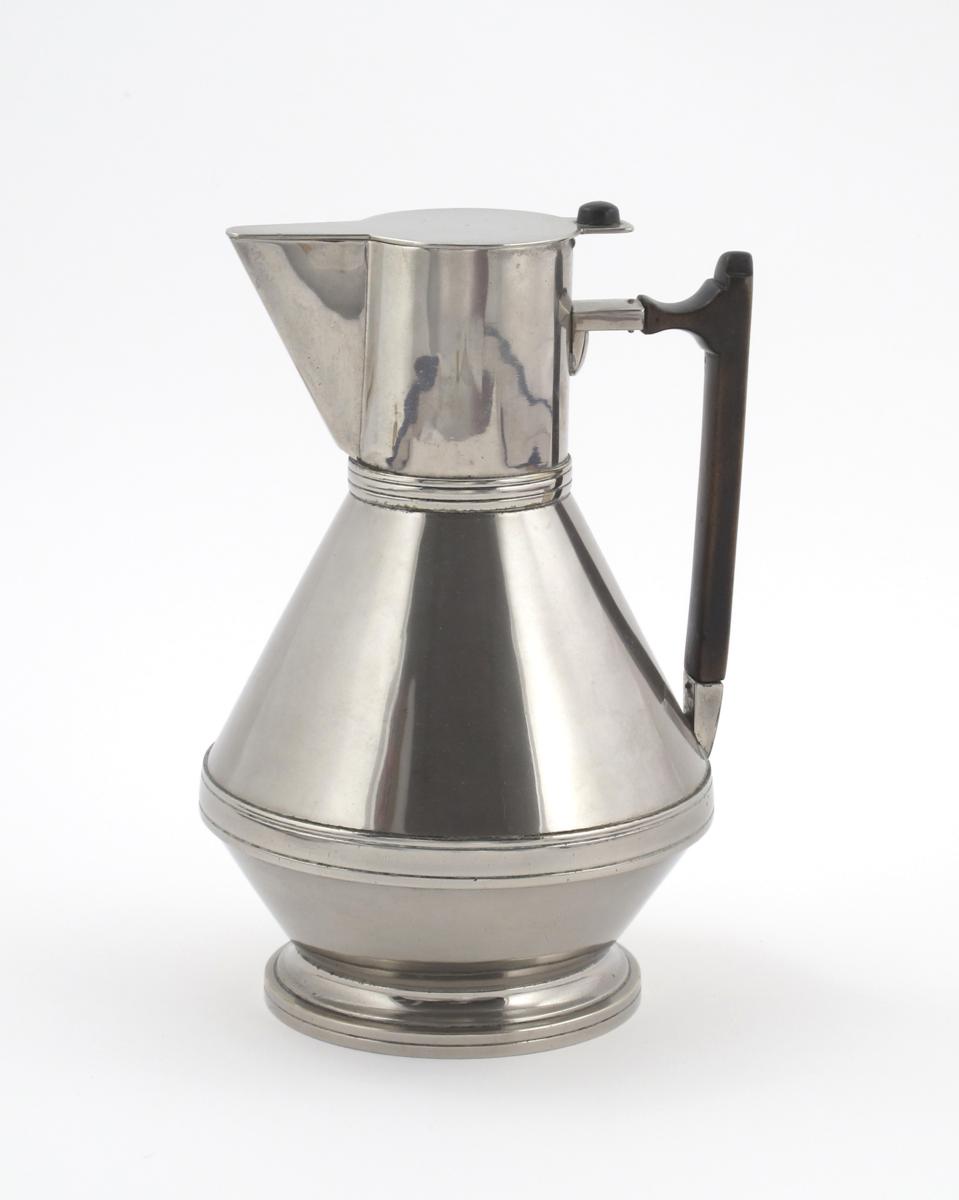 An electroplated metal jug in the manner of Dr Christopher Dresser, angular from with hinged