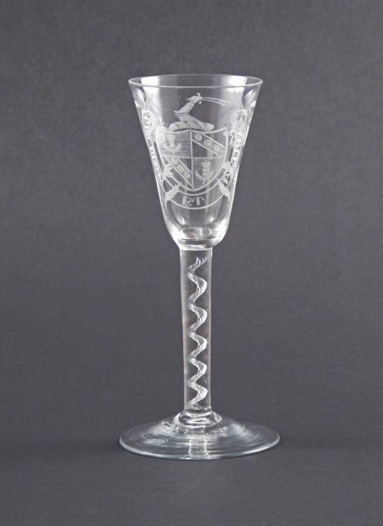 An armorial wine glass of anti-Jacobite relevance 18th century, engraved with a crest of an arm